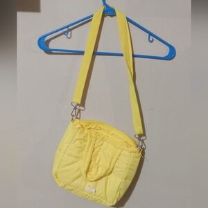 Cute new with tag yellow shoulder bag.